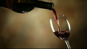 stock-footage-pouring-red-wine-into-glass